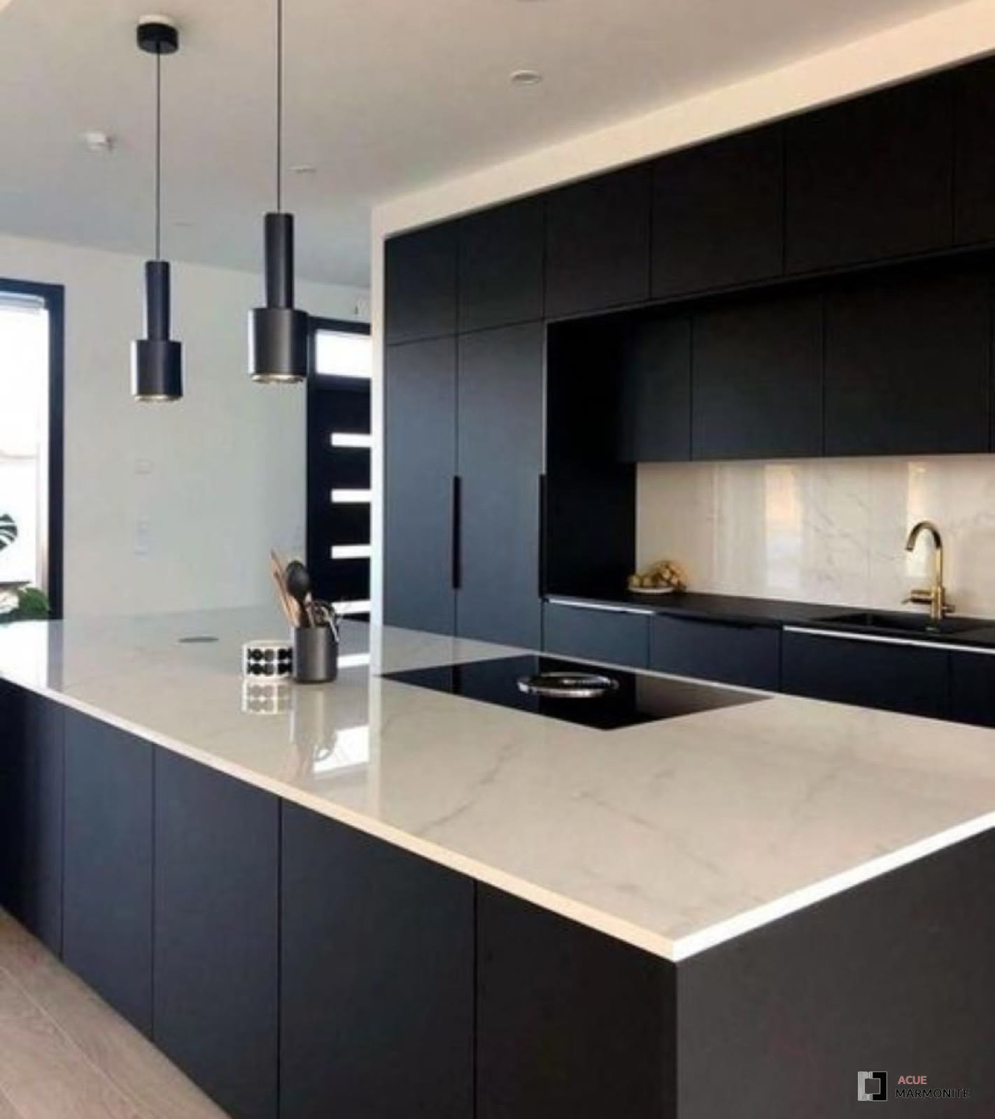 Custom matte black flat-panel kitchen cabinetry built and installed by Acue Marmonite